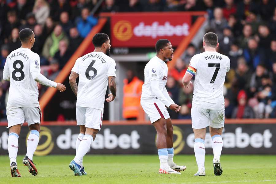 Leon Bailey of Aston Villa celebrates with teammates after scoring the team's first goal