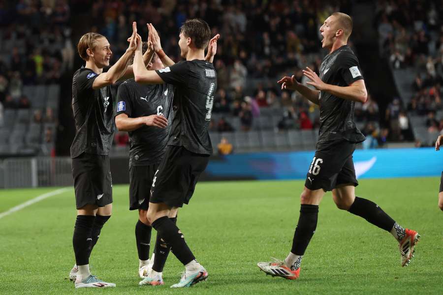 Ben Waine and his New Zealand teammates celebrate one of their four goals against Chile. Ben Waine and his New Zealand teammates celebrate one of their four goals against Chile.