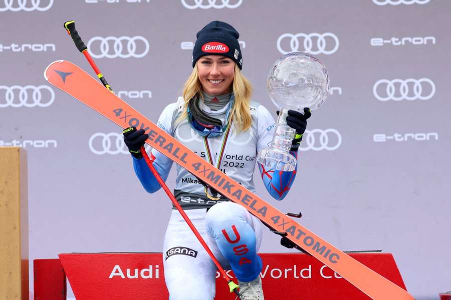 Mikaela Shiffrin of the U.S. celebrates on the podium after winning the overall Globe trophy