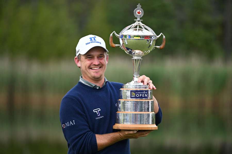 Bud Cauley holds the trophy after winning the Canadian Open Bud Cauley holds the trophy after winning the Canadian Open