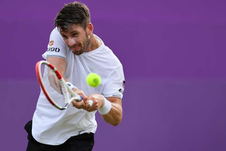 Britain's Cameron Norrie plays a backhand return