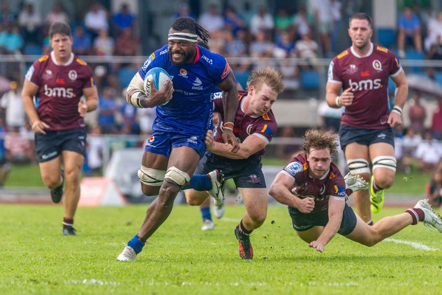Fijian Drua's Elia Canakaivata busts a tackle against Queensland at the weekend.