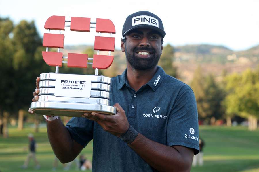 Sahith Theegala of the United States celebrates with the trophy after winning during the final round of the Fortinet Championship