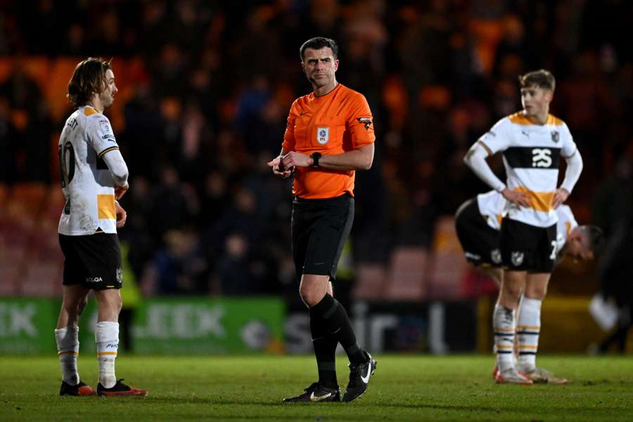 Craig Hicks (middle) took charge of Port Vale v Portsmouth yesterday. 