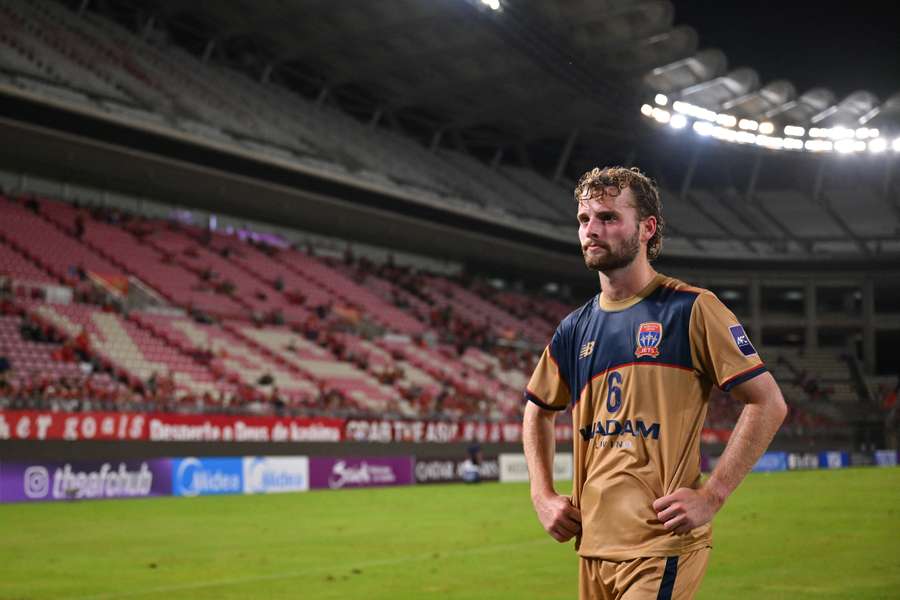 A dejected Zane Schreiber reflects after Newcastle's 7-1 AFC Champions League loss to Kashima Antlers.