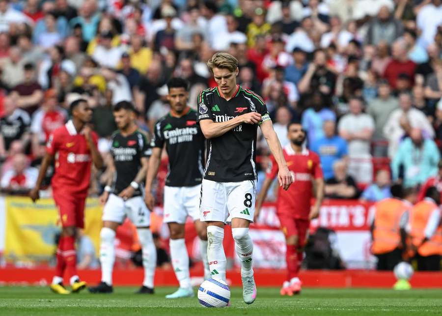 Liverpool, England, 11th May 2025. Arsenal's Martin Odegaard reacts as his side concede their first goal against Liverpool