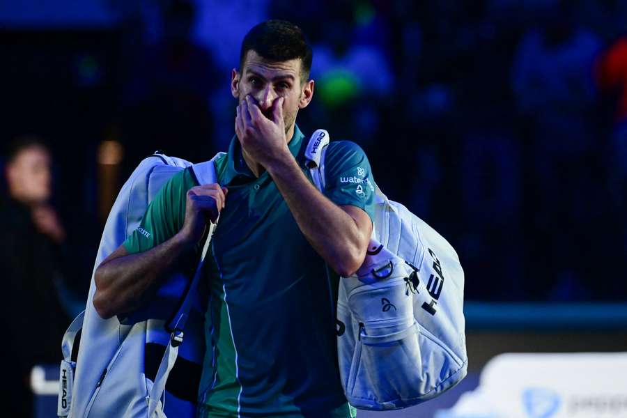 Novak Djokovic leaves the court after losing to Jannik Sinner