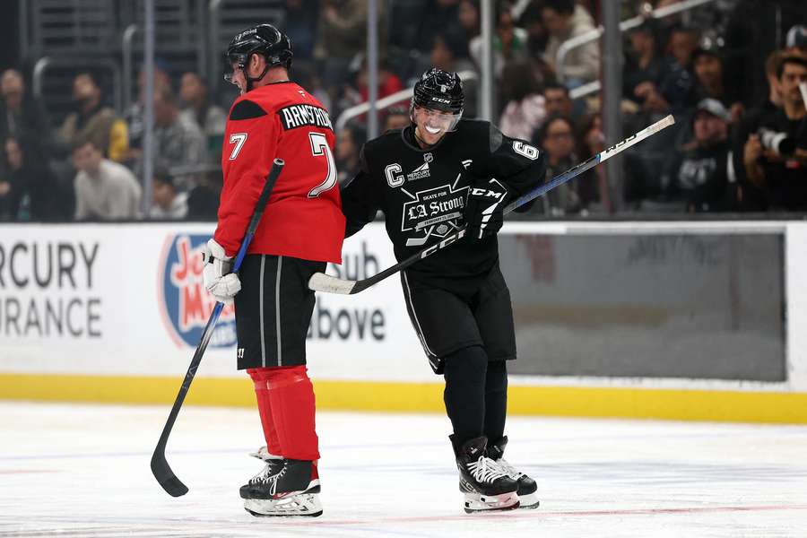 Justin Bieber (right) skating by Derek Armstrong (left) during the Skate for LA Strong charity event