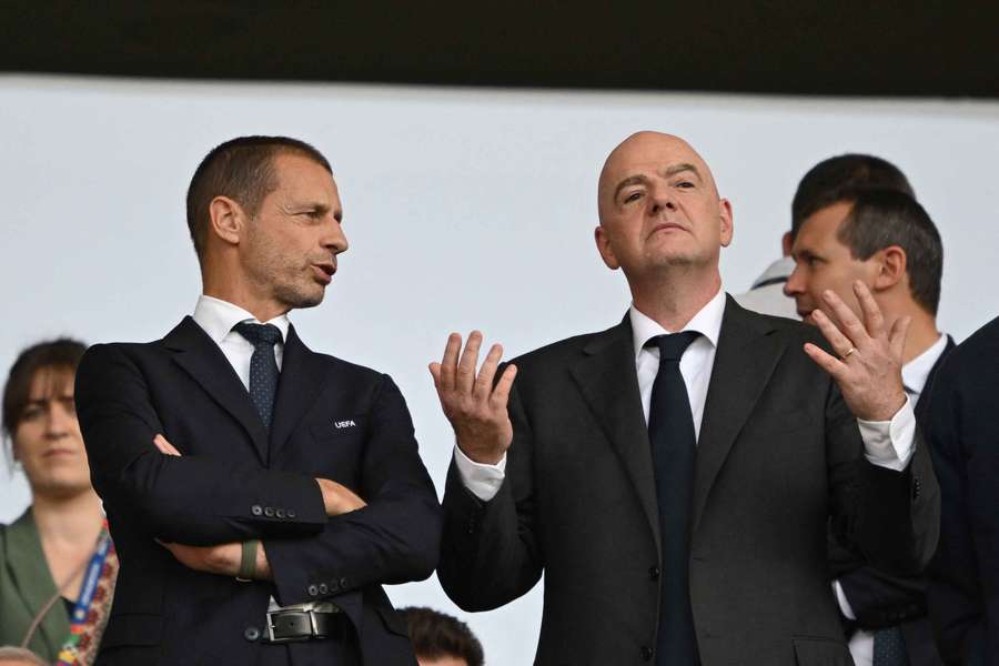 UEFA president Aleksander Ceferin (L) talks with FIFA president Gianni Infantino during a Euro 2024 match UEFA president Aleksander Ceferin (L) talks with FIFA president Gianni Infantino during a Euro 2024 match