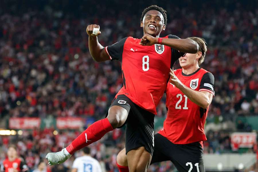 Austria's Junior Adamu celebrates scoring Austria's Junior Adamu celebrates scoring