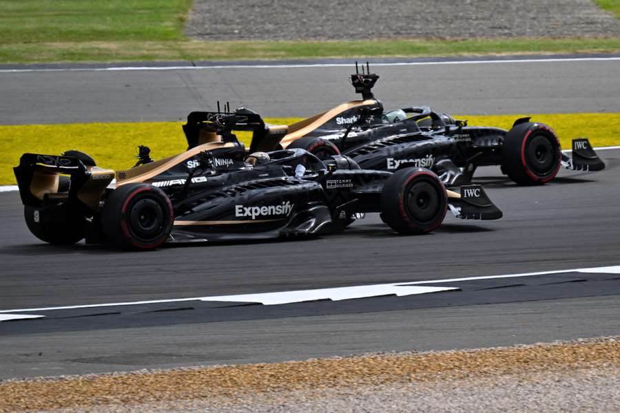 The cars of the fictional Apex team for an F1-inspired movie move along the track ahead of the Formula 1 British Grand Prix at Silverstone