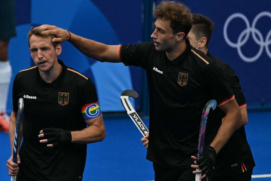 Moritz Ludwig, right, congratulates Germany's forward Niklas Wellen 