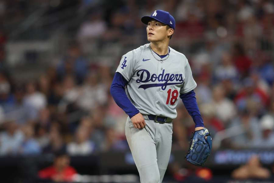 Yoshinobu Yamamoto looks on during NLDS Game 3 against the Atlanta Braves Yoshinobu Yamamoto looks on during NLDS Game 3 against the Atlanta Braves