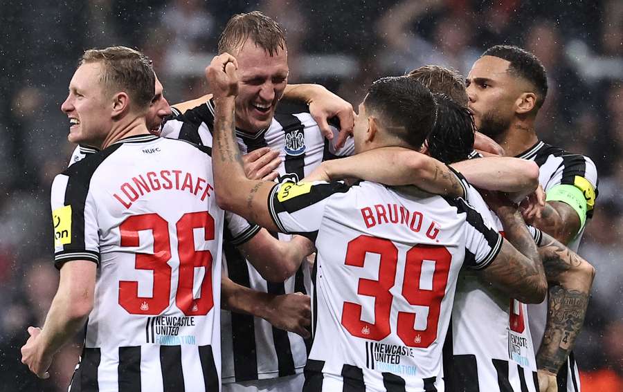 Dan Burn celebrates after scoring against PSG