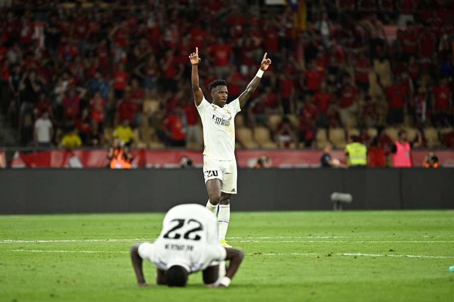 Real Madrid's Brazilian forward Vinicius Junior and German defender Antonio Rudiger celebrate at the end of the Spanish Copa del Rey final