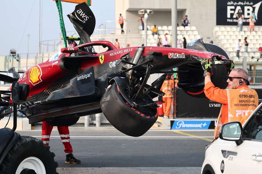 Stewards retrieve the car of Ferrari's Lewis Hamilton Stewards retrieve the car of Ferrari's Lewis Hamilton