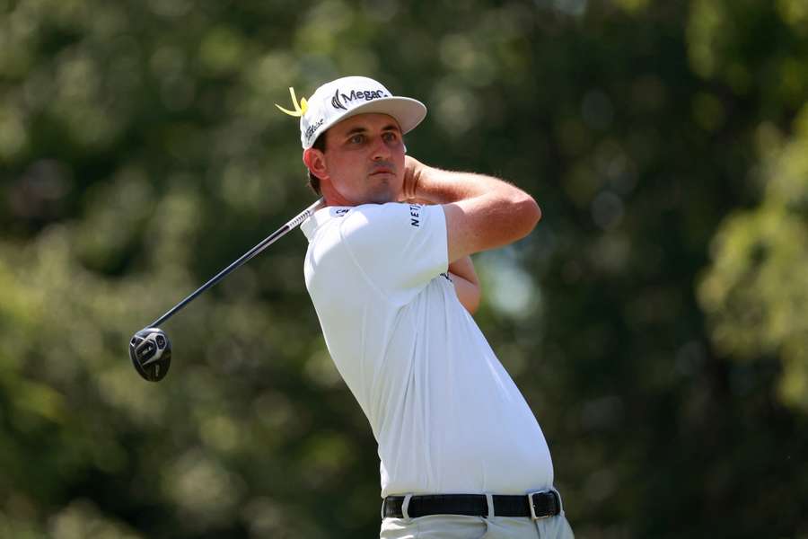 JT Poston hits off the 18th tee during second round of Memorial