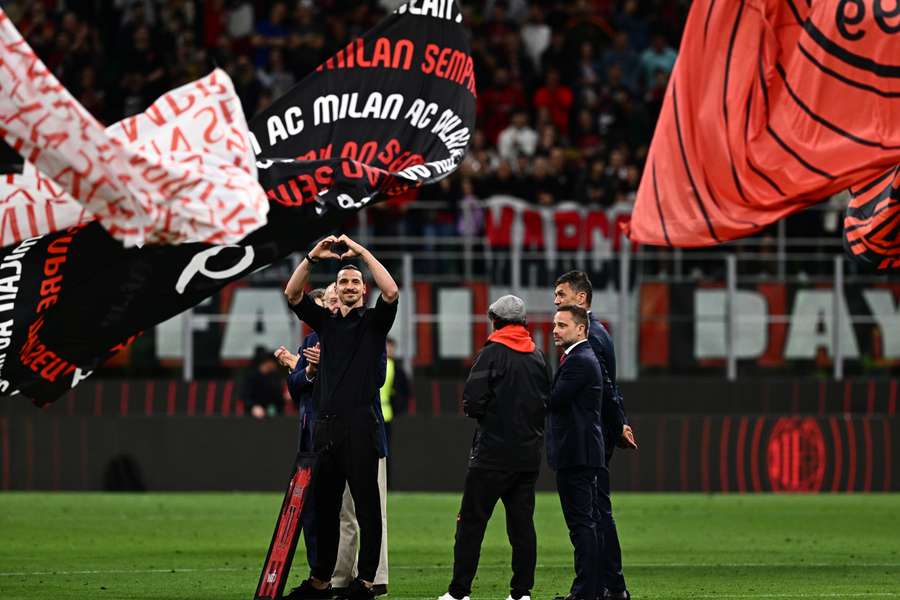 Zlatan Ibrahimovic (L) acknowledges the public during a farewell ceremony