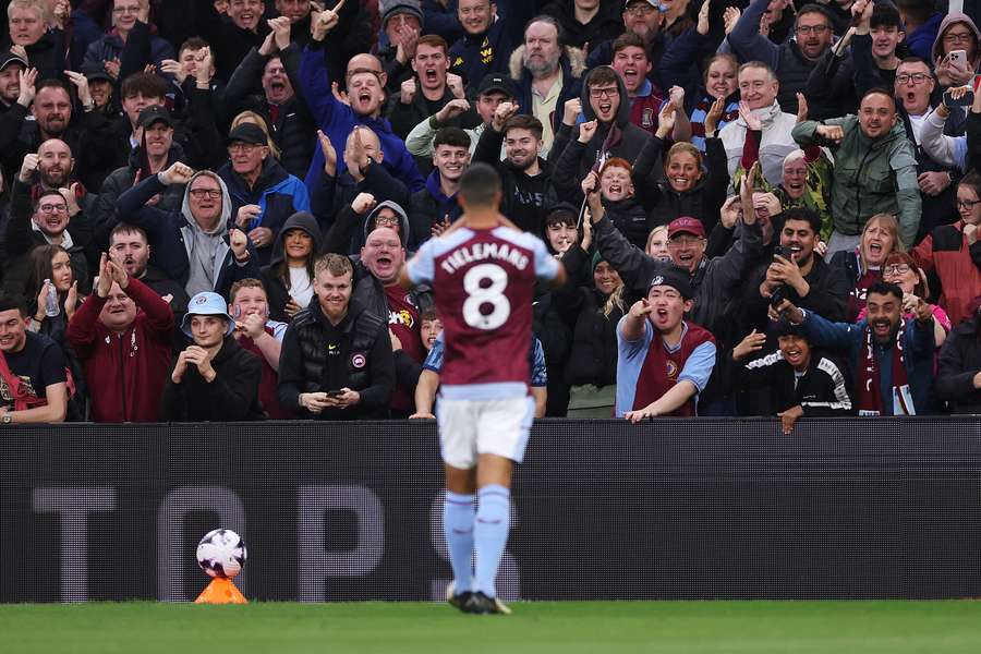 Youri Tielemans of Aston Villa (obscured) celebrates scoring his team's first goal