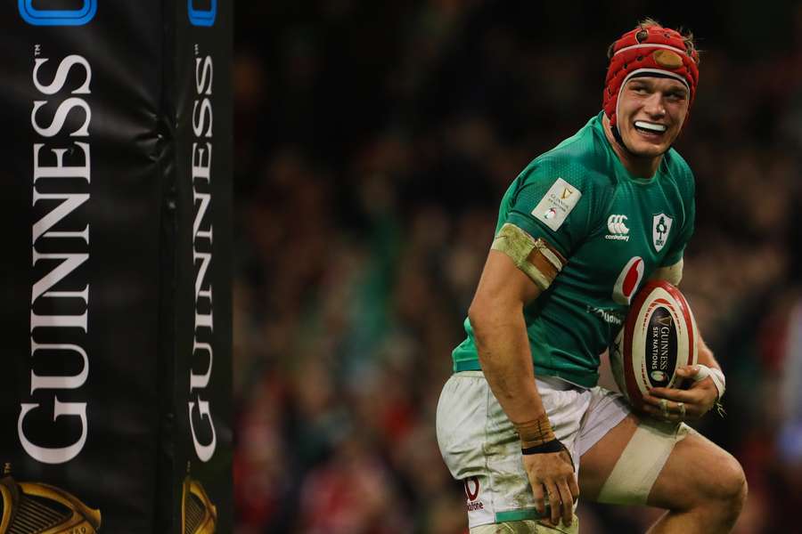 Ireland's flanker Josh van der Flier celebrates after scoring a try during the Six Nations international rugby union match between Wales and Ireland