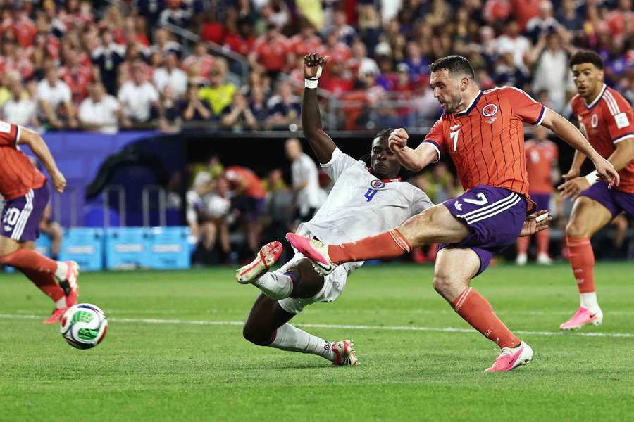 John McGinn slides home his winner against Haiti John McGinn slides home his winner against Haiti