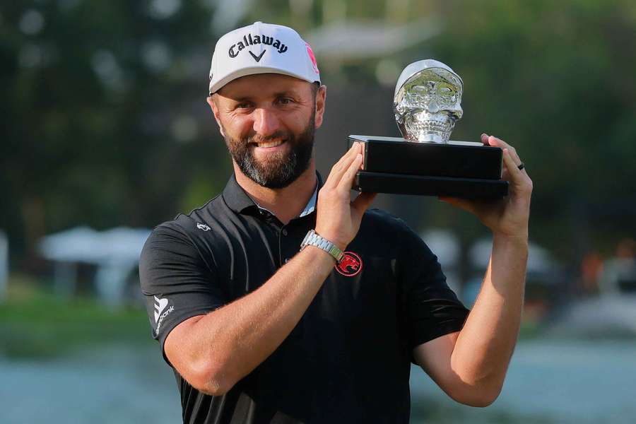Jon Rahm celebrates with the LIV Golf Mexico City trophy