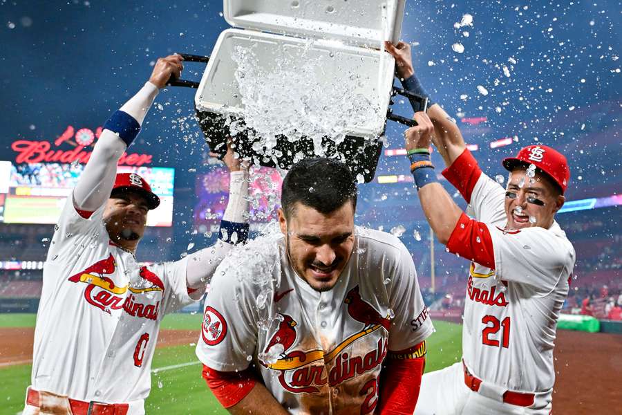 St. Louis Cardinals third baseman Nolan Arenado is doused with water