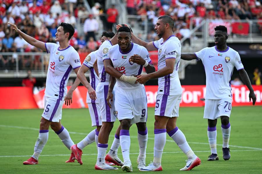 Al Ain's Laba Kodjo Fodoh (centre) is congratulated by teammates after scoring his team's first goal