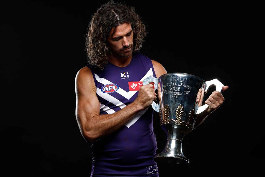 Fremantle captain Alex Pearce poses with the AFL Premiership Cup during a pre-season photo shoot.
