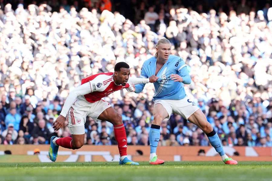 Arsenal's Gabriel Magalhaes marks Manchester City's Erling Haaland