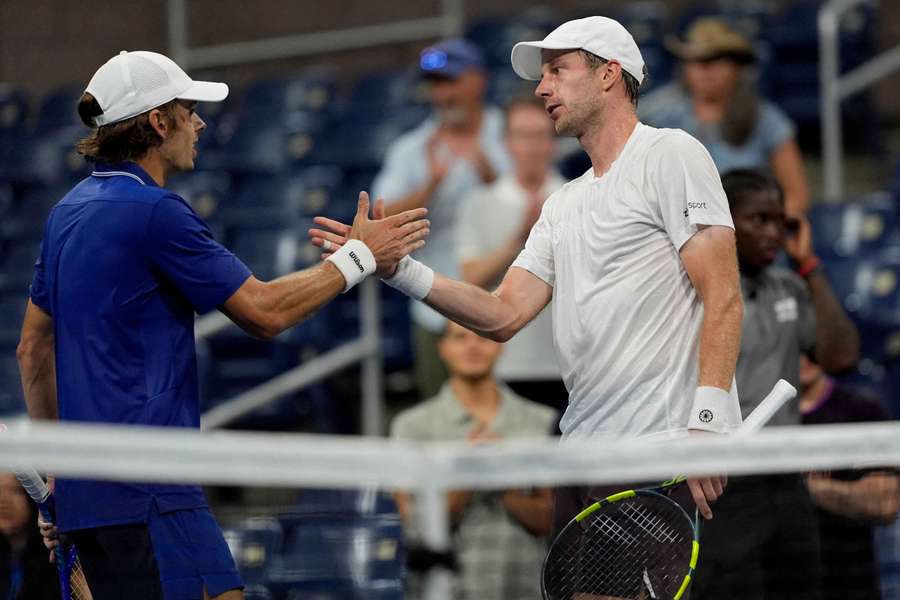 Netherlands' Botic van de Zandschulp shakes hands with Australia's Alex de Minaur after winning his second round match. Netherlands' Botic van de Zandschulp shakes hands with Australia's Alex de Minaur after winning his second round match.