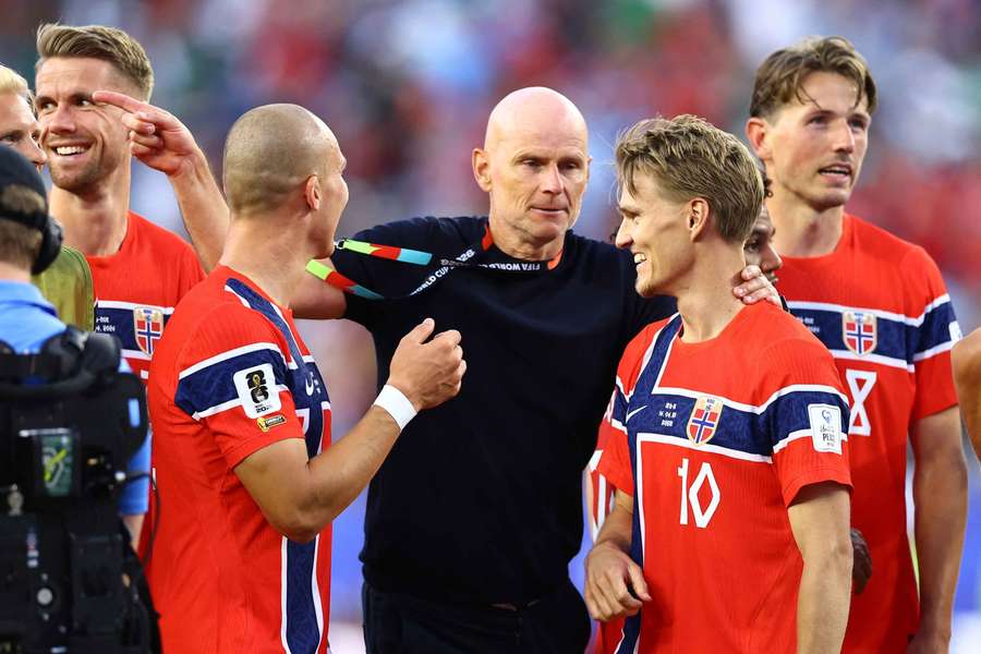 Stale Solbakken celebrates with his players after their win Stale Solbakken celebrates with his players after their win