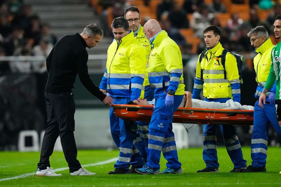 Feyenoord manager Robin van Persie consoles son Shaqueel as the latter gets stretchered off
