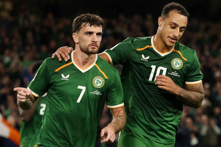 Republic of Ireland's Troy Parrott celebrates scoring their second goal with Adam Idah