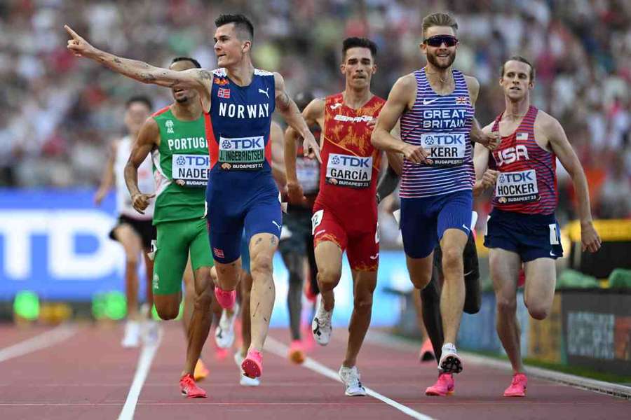 Jakob Ingebrigtsen points to the crowd as he finishes ahead of Josh Kerr