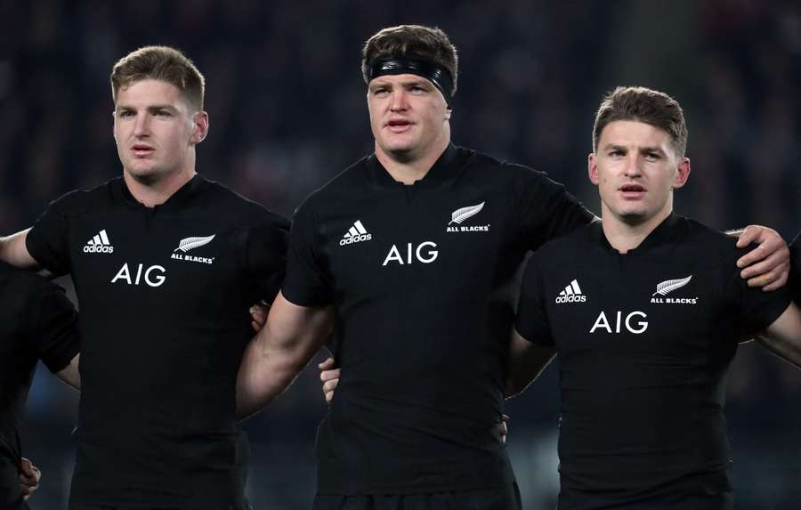 New Zealand's fly-half Jordie Barrett, lock Scott Barrett and full-back Beauden Barrett sing the national anthem prior to the first rugby Test match between New Zealand and France