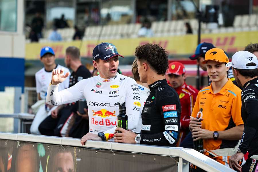 Max Verstappen chats with Lando Norris