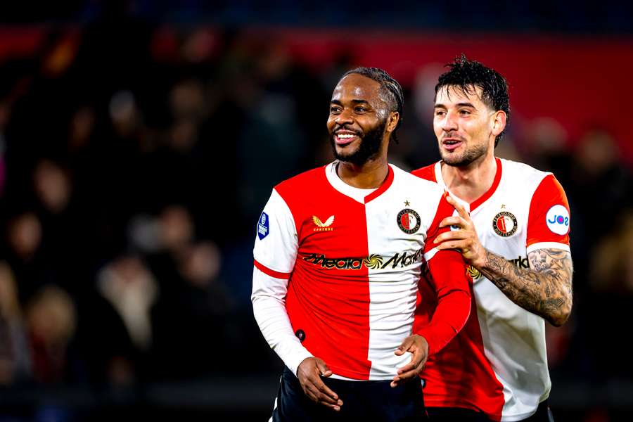 Feyenoord's Raheem Sterling gets pushed to the home fans by teammate Jakub Moder following his debut against Telstar