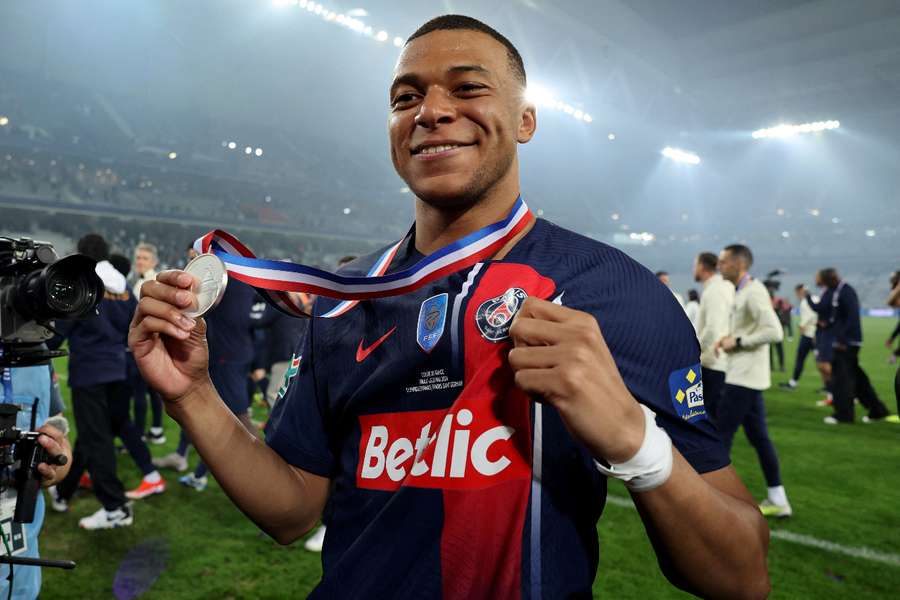 Mbappe with his winner's medal 