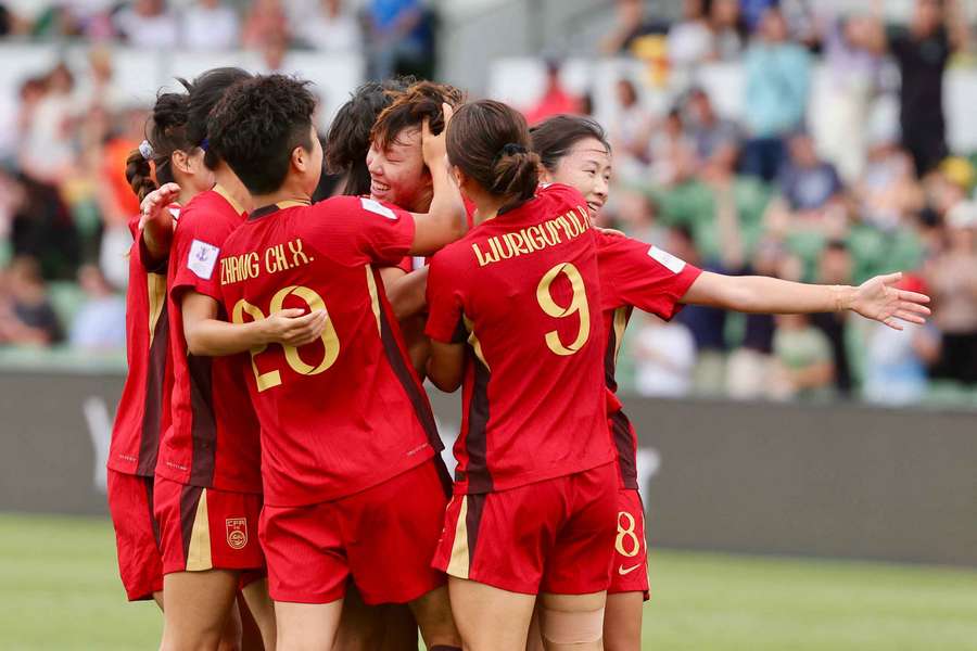 China celebrates their winning goal during their Women's Asian Cup quarter-final. China celebrates their winning goal during their Women's Asian Cup quarter-final.