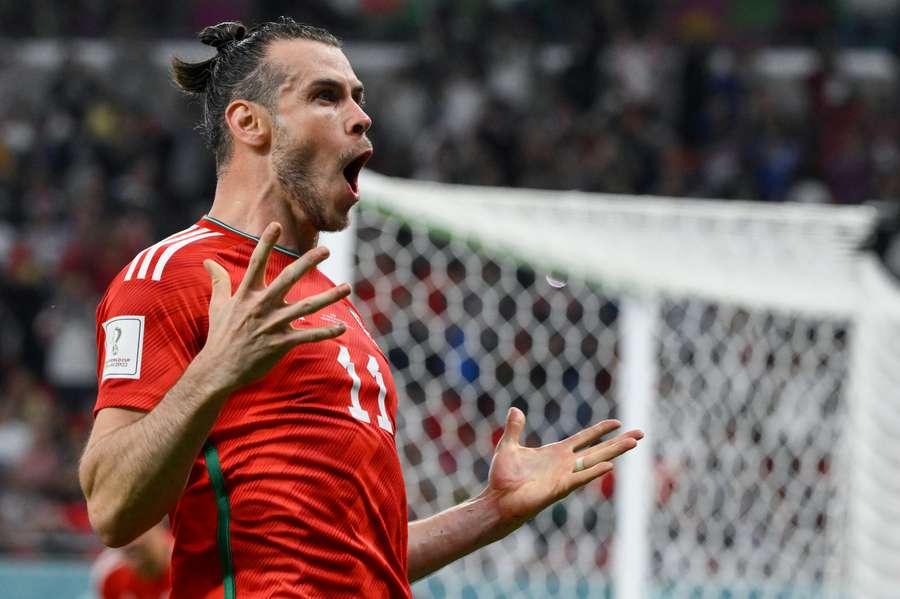 Gareth Bale celebrates scoring Wales' equalising goal against USA.