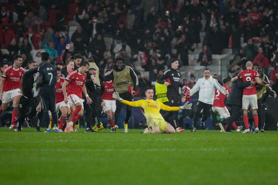 Benfica players celebrate a last-minute goal against Real Madrid Benfica players celebrate a last-minute goal against Real Madrid