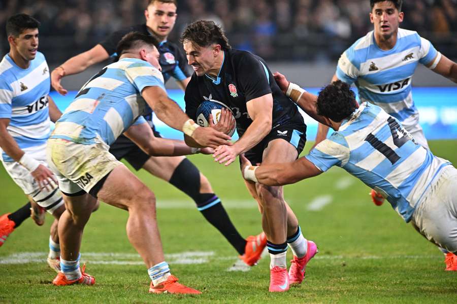  England's Cadan Murley in action with Argentina's Rodrigo Isgro and Julian Montoya