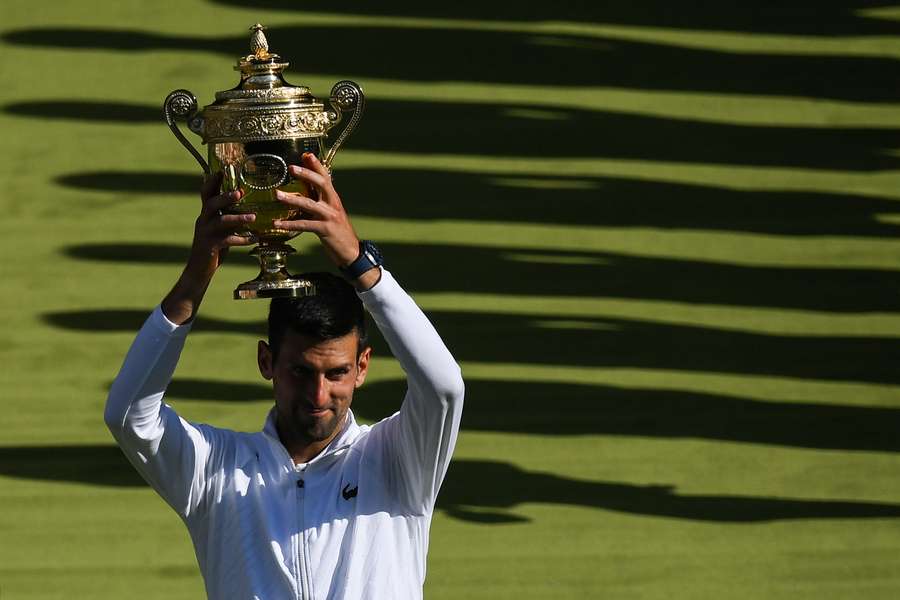 Novak Djokovic raises the Wimbledon trophy