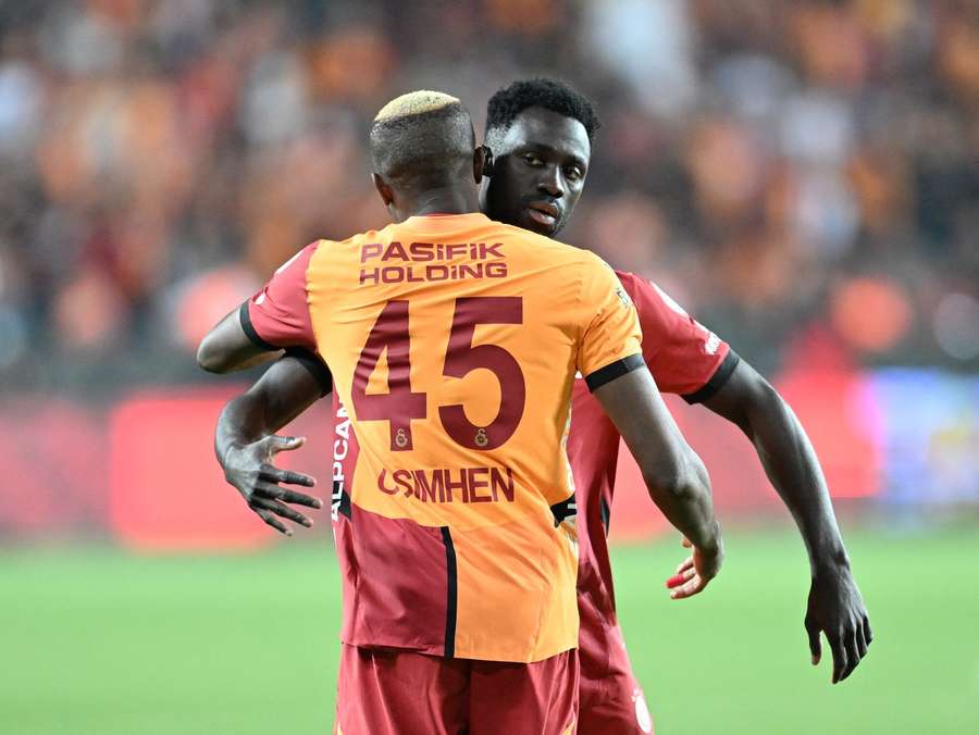 Victor Osimhen and Davinson Sanchez embrace Victor Osimhen and Davinson Sanchez embrace