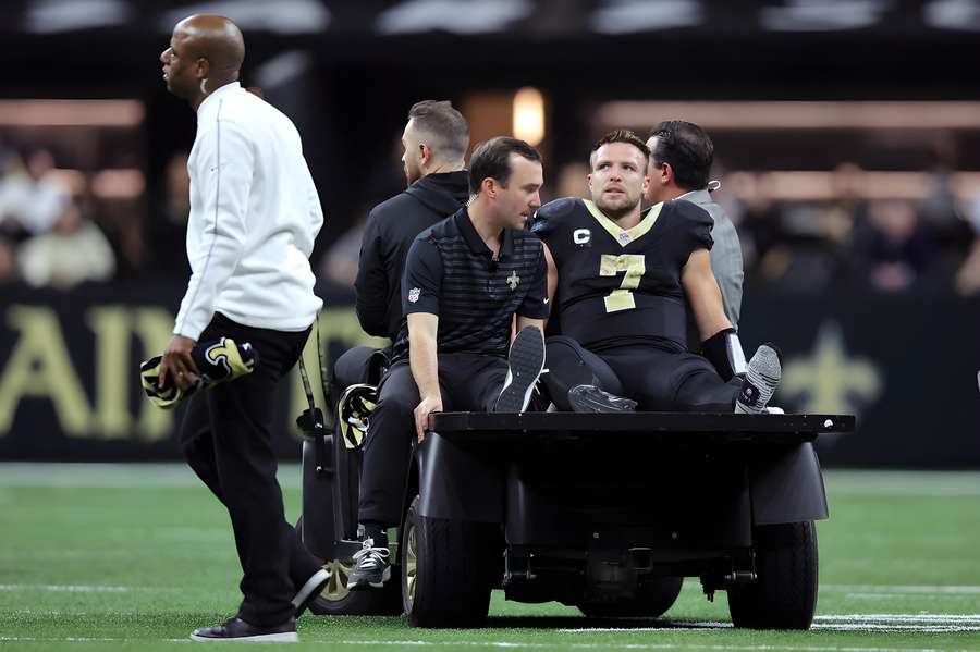 Taysom Hill taken off on a cart during the Rams game after suffering a torn ACL.