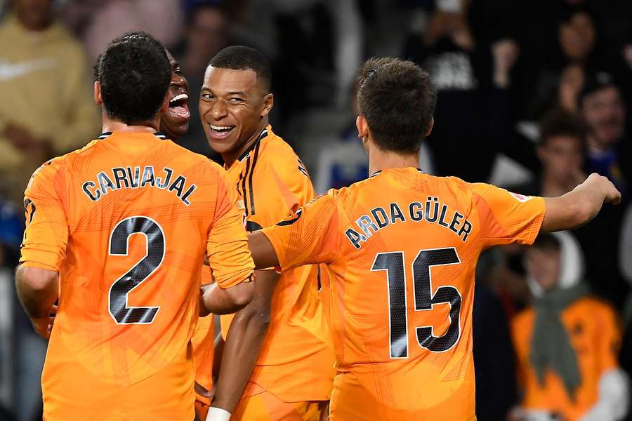 Real Madrid's French forward Kylian Mbappe (centre) celebrates scoring his team's second goal