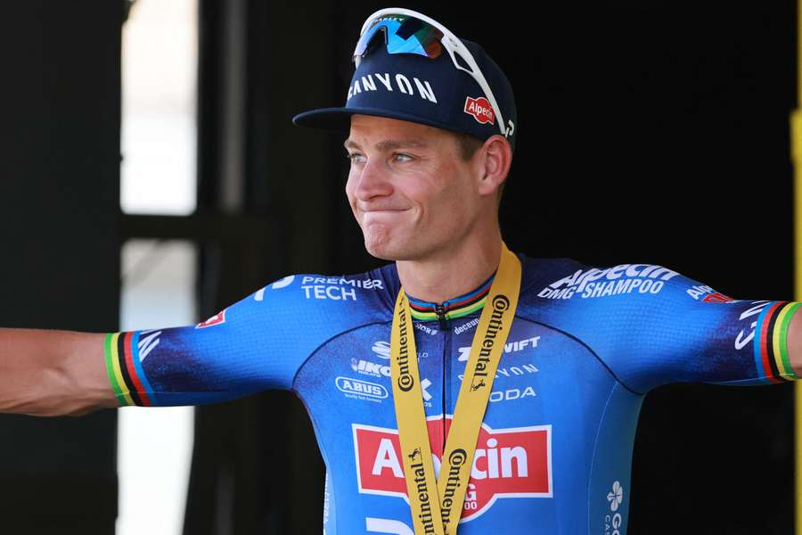 Mathieu Van Der Poel celebrates on the podium after winning stage nine 