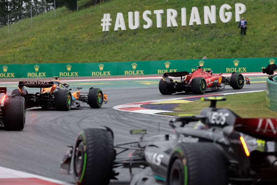 Ferrari's Charles Leclerc and McLaren's Lando Norris in action during the sprint race in Austria