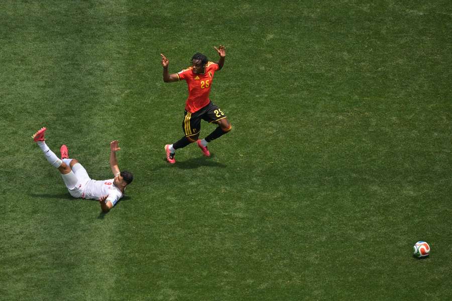 Iran's Mehdi Taremi reacts after a foul by Belgium's Nathan Ngoy Iran's Mehdi Taremi reacts after a foul by Belgium's Nathan Ngoy